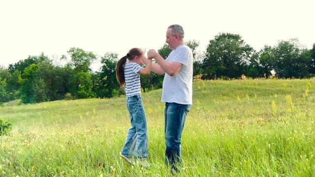 happy family, children dream fun fly, kid with father playing outdoors, Happy childhood memories created, man and child connect by playing, nature as their playground, sunlight bathes the scene