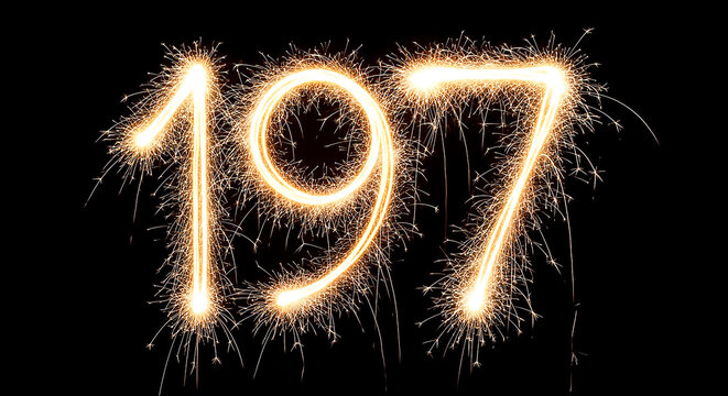 Dramatic sparkler effect creating the year 1977, evoking celebration and nostalgia on a dark backdrop.
