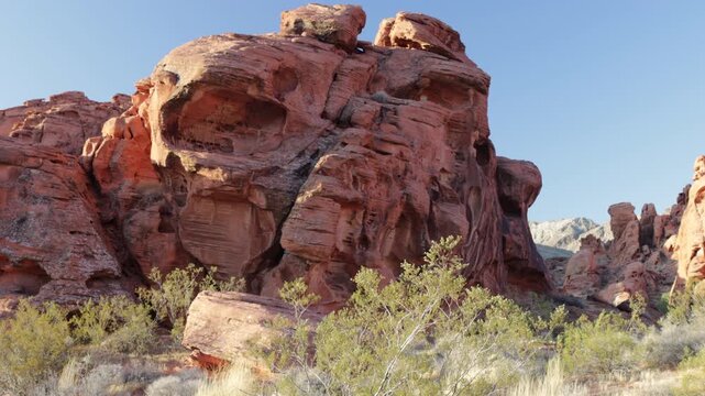 Landscape view of the iconic red Aztec sandstone formations and blowing grasses at Valley of Fire State Park in Nevada