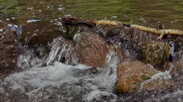Close up of small rock dam and creek in Colorado