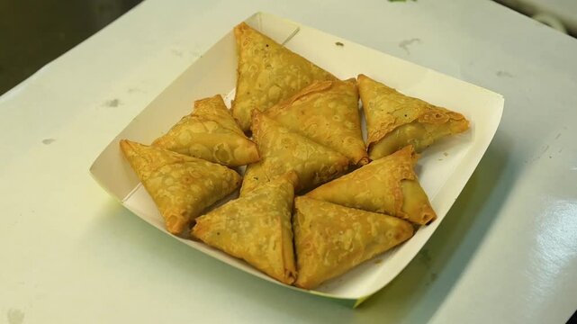 Samosa served in a paper plate as a street food 