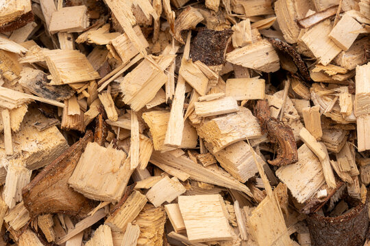 Wood chips close up, biomass fuel texture for heating season and renewable energy