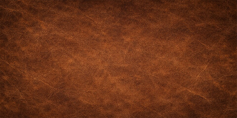 Fototapeta premium An antique brown leather texture background with a grungy, aged pattern reminiscent of old vintage parchment or a rough textured surface