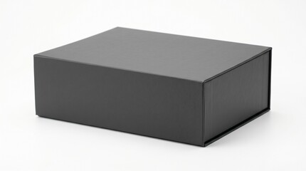 Naklejka premium A black rectangular box sits on a plain white surface.