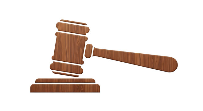 Wooden judicial gavel resting on a sounding block crafted from polished timber for legal concepts