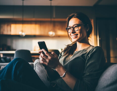 Happy young woman smiling with confidence and positive energy. Modern lifestyle portrait ideal for wellness, happiness, self-esteem and personal growth concepts.