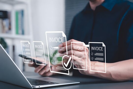 Digital E-Invoice and Billing Management Concept. Businessman using laptop and pen with invoice documents, representing electronic invoicing and digital billing systems. invoice for payment, receipt,