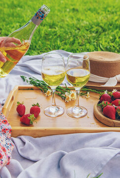 Picnic with strawberries and wine. Selective focus.
