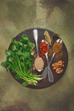 Georgian spices in spoons, on ketsi, top view, no people,