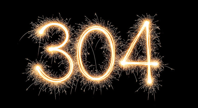 Vibrant sparkler display forming the number 304, creating a striking visual effect on a dark background, ideal for celebrations or special events.