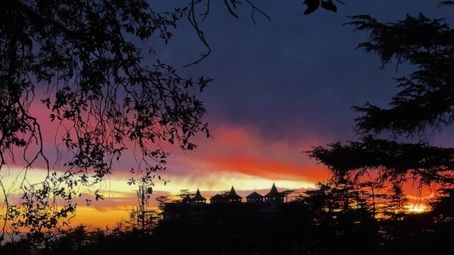 breathtaking evening sky over hill station with colorful twilight and dark forest outline