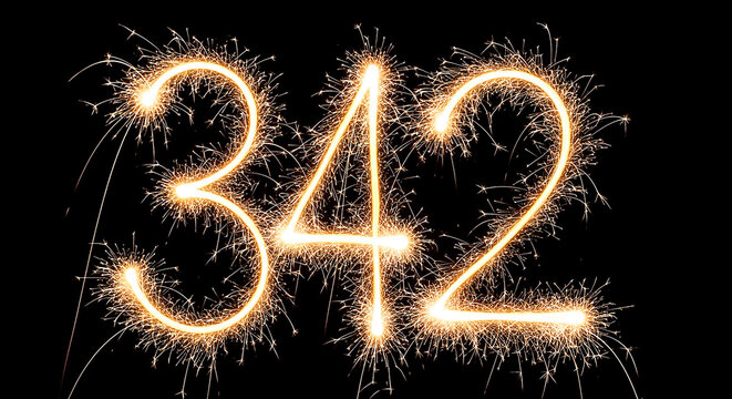 Vibrant sparkler effect forming the number 342 against a dark backdrop, ideal for celebrations or creative projects.
