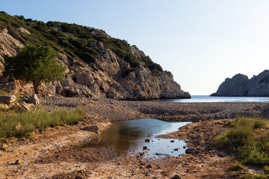 Remote paradise cove of Avlonia beach with pebble coast on Chios island