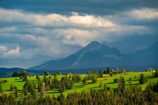 Scenic view of majestic Belianske Tatra mountains and green hills
