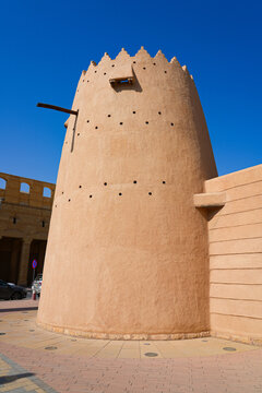 Traditional mud brick watchtower with decorative crenellations in Al Dho historical district, Riyadh, Saudi Arabia