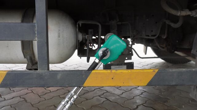CNG Vehicle Refueling with Nozzle and Gas Tank