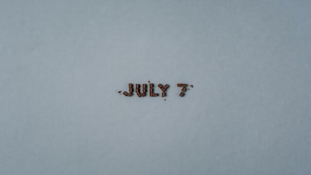 Skywriting forms JULY 7 message in clear blue sky
