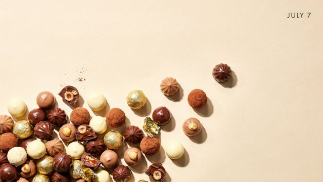 Scattered hazelnuts and beechnuts on a beige surface with shadows