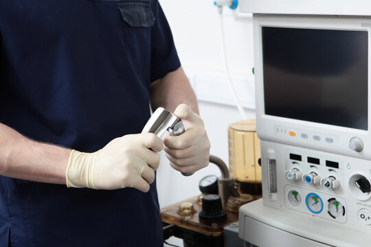 Laryngoscope for tracheal intubation in hands of an anesthesiologist. General anesthesia before surgery. Concept of healthcare. Saving life