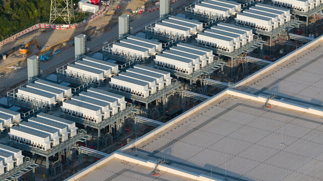 Aerial drone view of hyperscale data center construction in Farciennes, showing high tech cloud, big data, AI infrastructure and power systems.