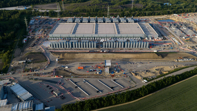 Aerial drone view of hyperscale data center construction in Farciennes, showing high tech cloud, big data, AI infrastructure and power systems.