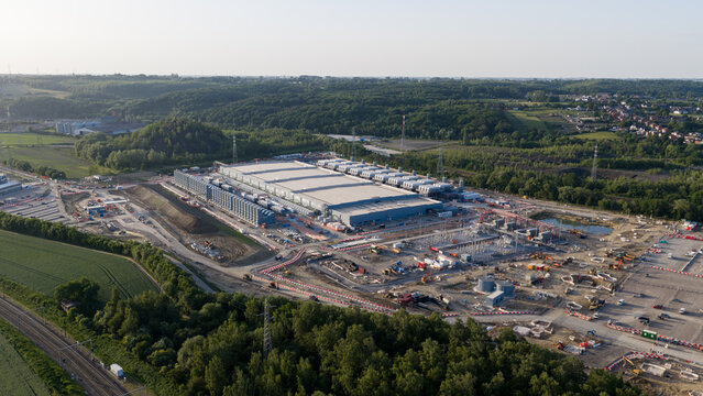 Aerial drone view of hyperscale data center construction in Farciennes, showing high tech cloud, big data, AI infrastructure and power systems.