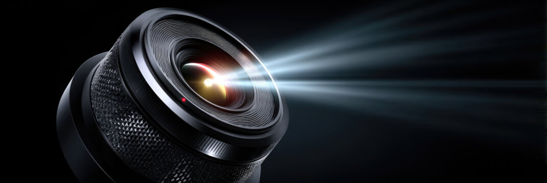Portable mini projector casting a bright light beam, creating an immersive home cinema experience, illustrating modern entertainment technology and video projection