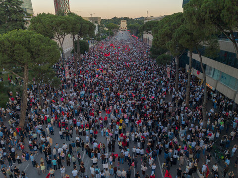 High angle aerial photo of dense protest crowd in Tirana