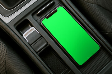 Blank smartphone in car console photo, suitable as mockup © Rawpixel.com