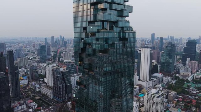 Bangkok, Thailand - 31 May 2026: Aerial view of King Power Mahanakhon skyscraper with its unique pixelated facade and surrounding urban skyline.