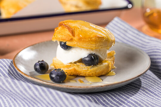 Scone Filled with Blueberry  and Clotted Cream on a plate