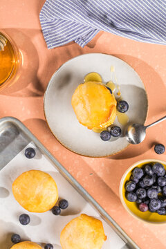 Scone Filled with Blueberry  and Clotted Cream on a plate