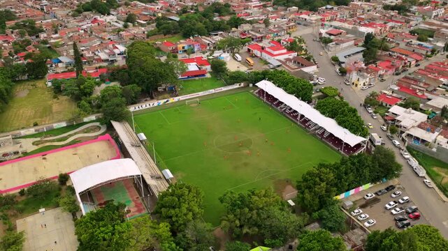 Tuxpan, Mexico - 28 May 2026: Aerial view of Estadio Municipal de Tuxpan Jalisco with its green soccer field, white grandstands, and surrounding urban landscape.