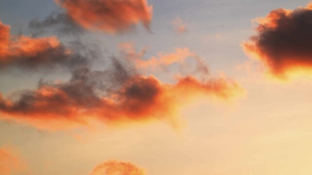 View of a helicopter flying through orange and pink clouds during sunset in Rio de Janeiro, Rio de Janeiro, Brazil.