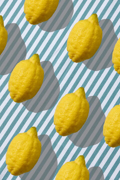 Fresh Lemons for Homemade Lemonade on a Blue Striped Tablecloth for Picnic. Top View