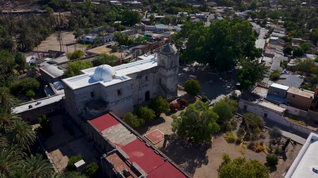 Watch aerial views showcasing the mission church located in the oasis town of San Ignacio in Baja California, Mexico.