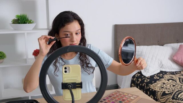 Influencer girl streaming a makeup tutorial live