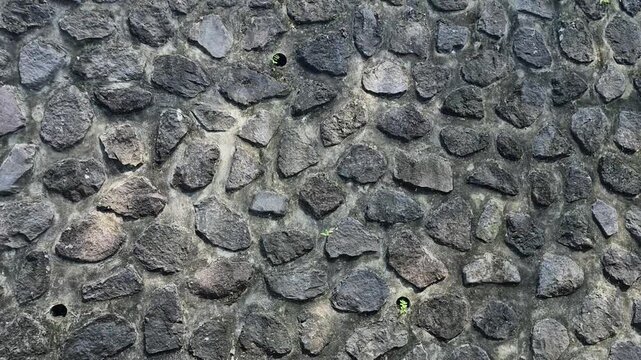Close-up of textured stone wall with natural pattern