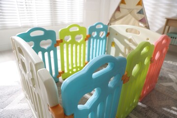 Beautiful playpen and wigwam in child's room, closeup © New Africa