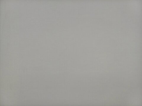 Minimalist plain grey background texture with soft vignette