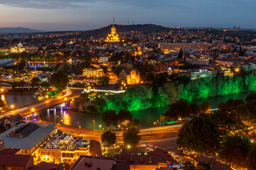 Naklejka premium Western Asia, South Caucasus, Republic of Georgia, Tbilisi. City overview, skyline. Sunset.