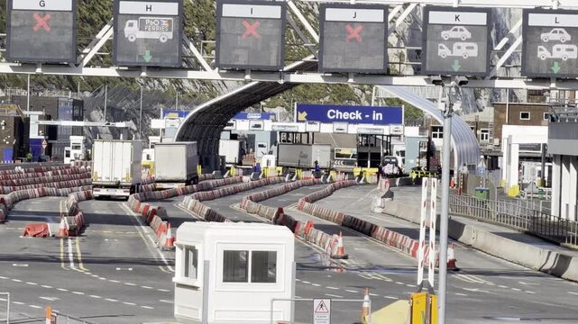 Commercial trucks waiting at border station 4K