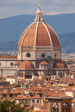 Florence's iconic dome rises above red-tiled rooftops