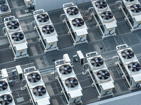 Aerial view of industrial air conditioning units and ventilation fans on the rooftop of the T-Mobile Data Center in Warsaw, Mazowieckie, Poland.