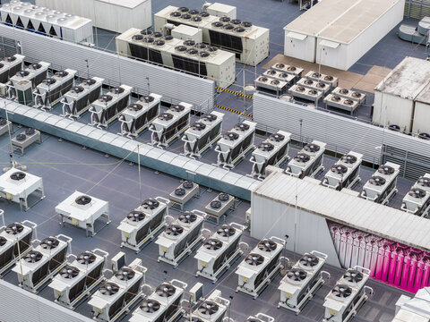 Aerial view of industrial air conditioning units and ventilation systems on the rooftop of the Datacenter T-Mobile in Warsaw, Masovian Voivodeship, Poland.