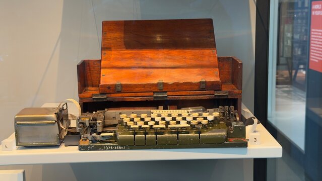 Vintage Mechanical Cipher Machine with Wooden Case on Museum Display