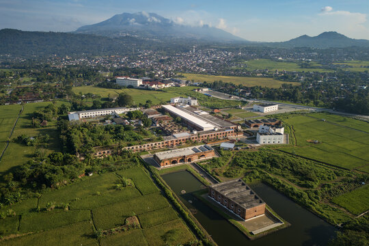Aerial view of Benteng Fort Willem I, a historic colonial fortress surrounded by lush green rice fields and the urban landscape of Ambarawa, Central Java, Indonesia.