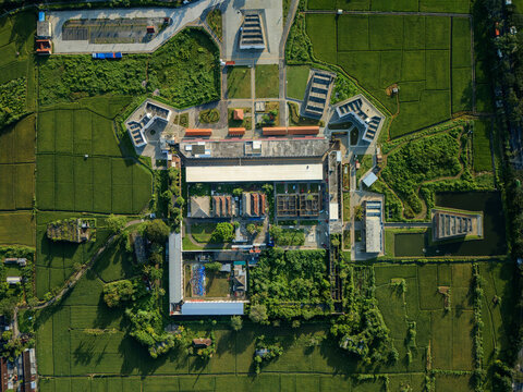 Aerial view of the historic Benteng Fort Willem I with its rectangular stone walls and internal structures surrounded by lush green rice fields in Ambarawa, Central Java, Indonesia.