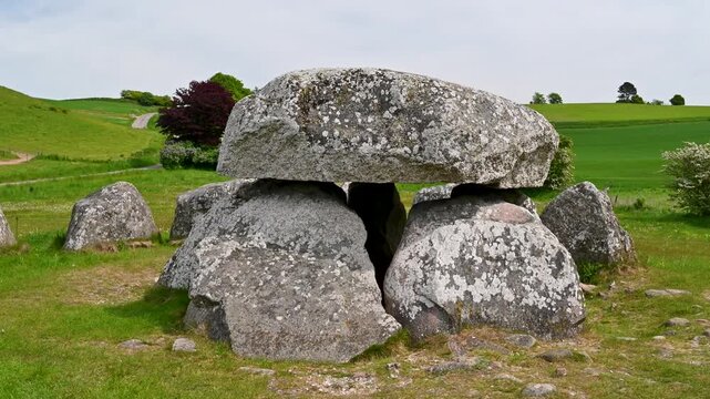 Ancient stone dolmen burial ground surrounded by natural landscape in Mols Bjerge National Park Denmark