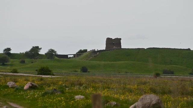 Ancient Kal&oslash; Castle ruins overlooking coastal Viking landscape in Mols Bjerge National Park Denmark